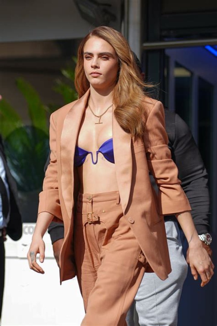 Cara Delevingne Rocks Electric Purple Bra With Stylish Tan Suit: Photos