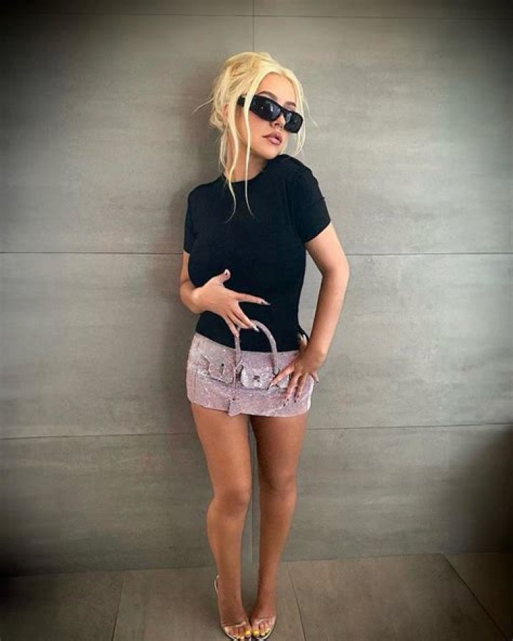 Christina Aguilera Dazzles in Micro Mini ‘Purse Skirt’: Says It’s Holding ‘Precious Goods’