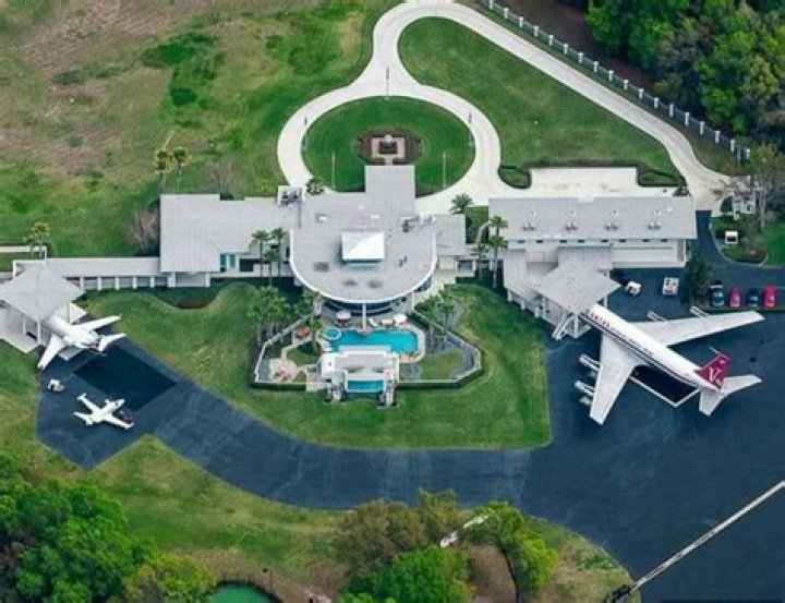 Does John Travolta have a landing strip at his house?