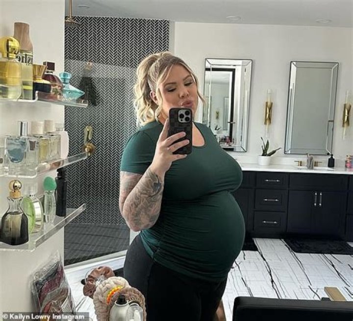 Hot Mama AlertAmber Rose Shows Off Her Growing Baby Bump in Nude Heels and Form-Fitting Dress
