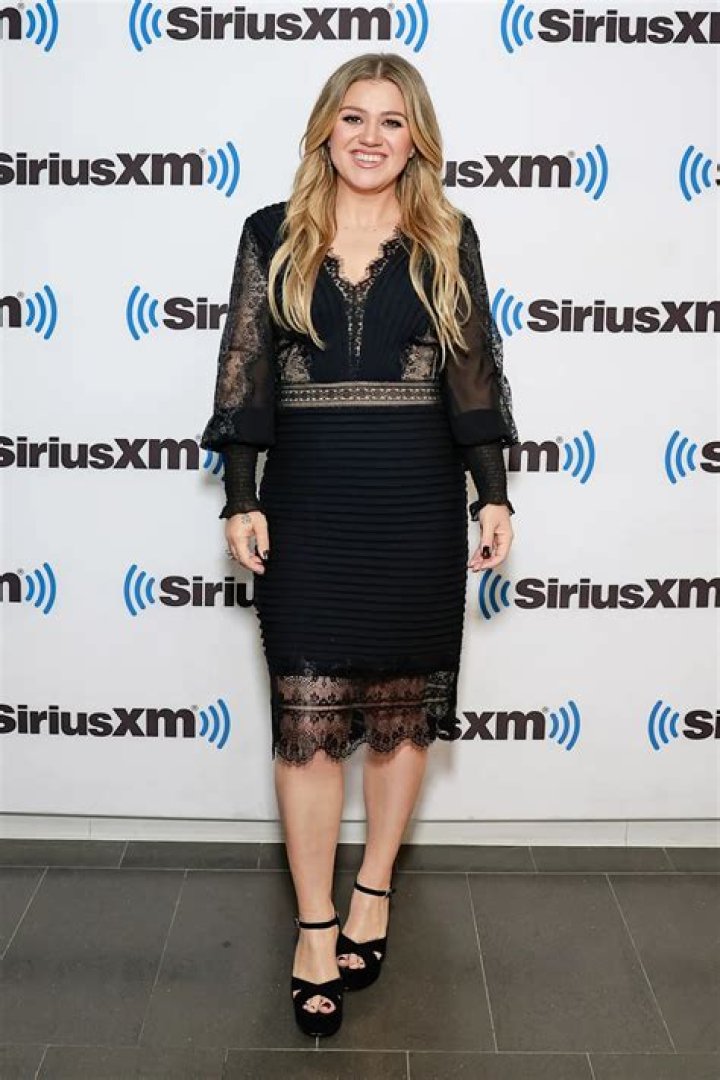 Kelly Clarkson Shows Off Weight Loss as She Stuns in Sheer, Lacy Black Dress for Radio Show