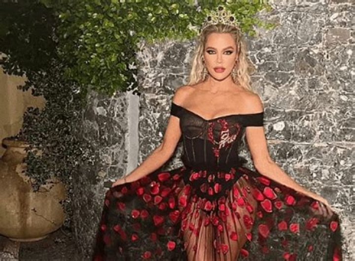 Khloe Kardashian, in a dress with a defiantly transparent skirt