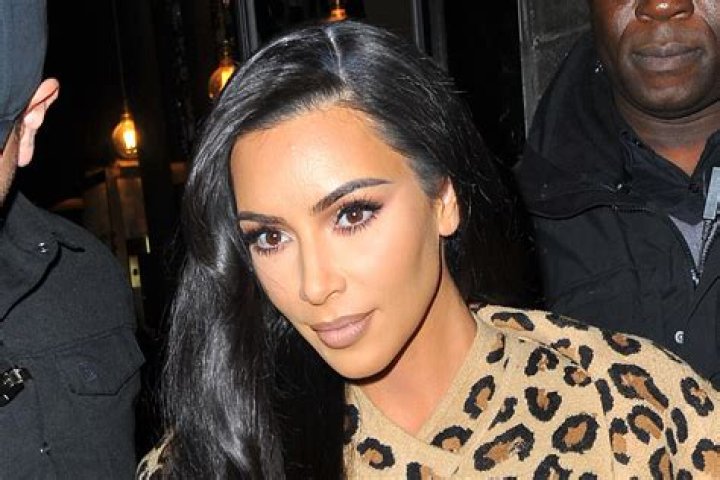 Kim Kardashian Looks Extra ~Fierce~ Arriving in Paris Rocking Leopard Print Head to Toe!