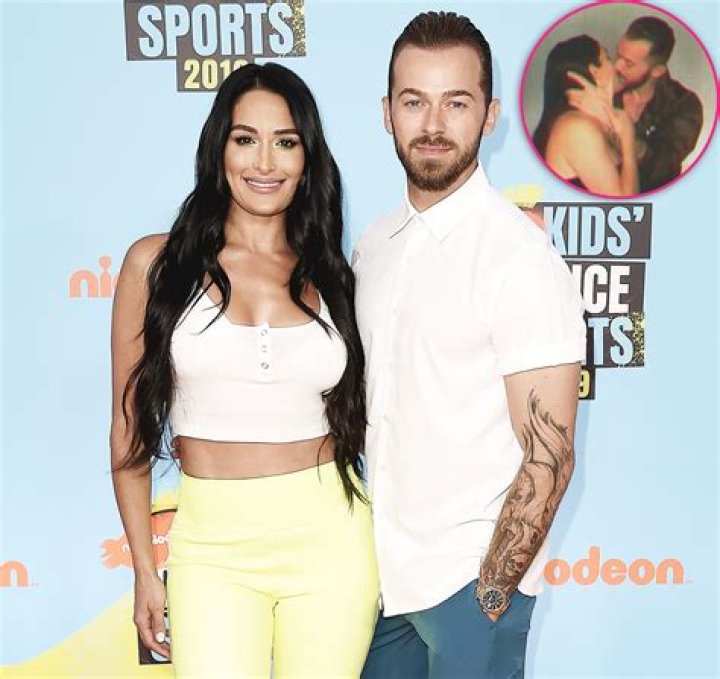Nikki Bella and Artem Chigvintsev Kiss in Steamy ‘Hidden Cam’ Footage: ‘Mama Getting Her Groove Back’