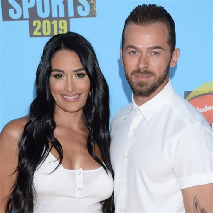 Nikki Bella Wraps Her Legs Around Boyfriend Artem Chigvintsev During Cute PDA-Packed Moment
