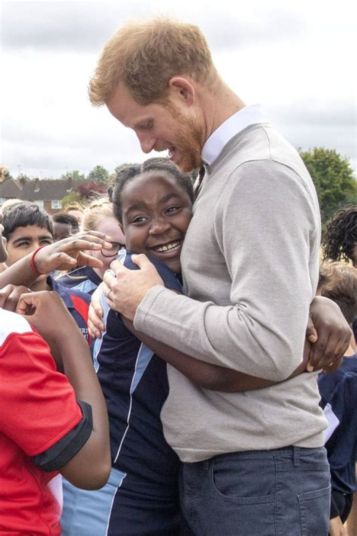 Prince Harry Hilariously High-Fives Kids Who Reportedly Skipped School To See Him And Meghan Markle